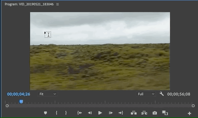Creating a text box on the Program Monitor with the Type Tool and writing "Iceland"