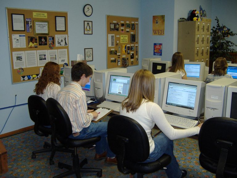 1990s-era college students working in a computer lab that probably smelled like shrink-wrap plastic and polyester carpet